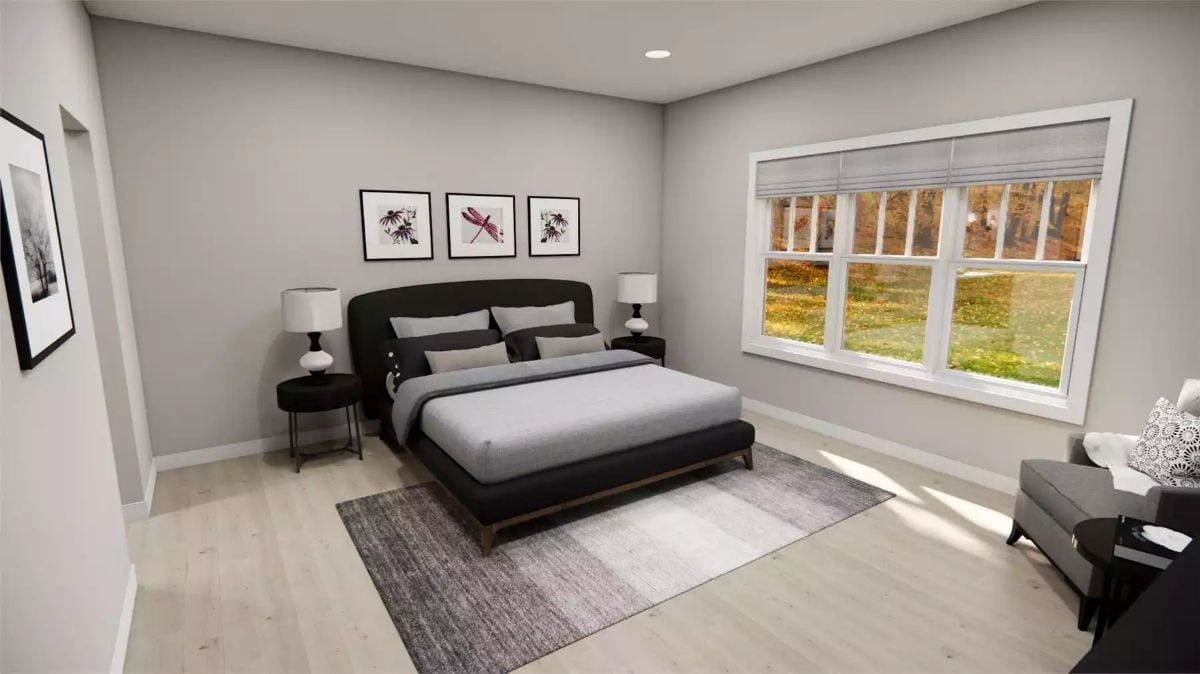 Platform Bed With Curved Headboard Anchors a Room That Knows When to Stop