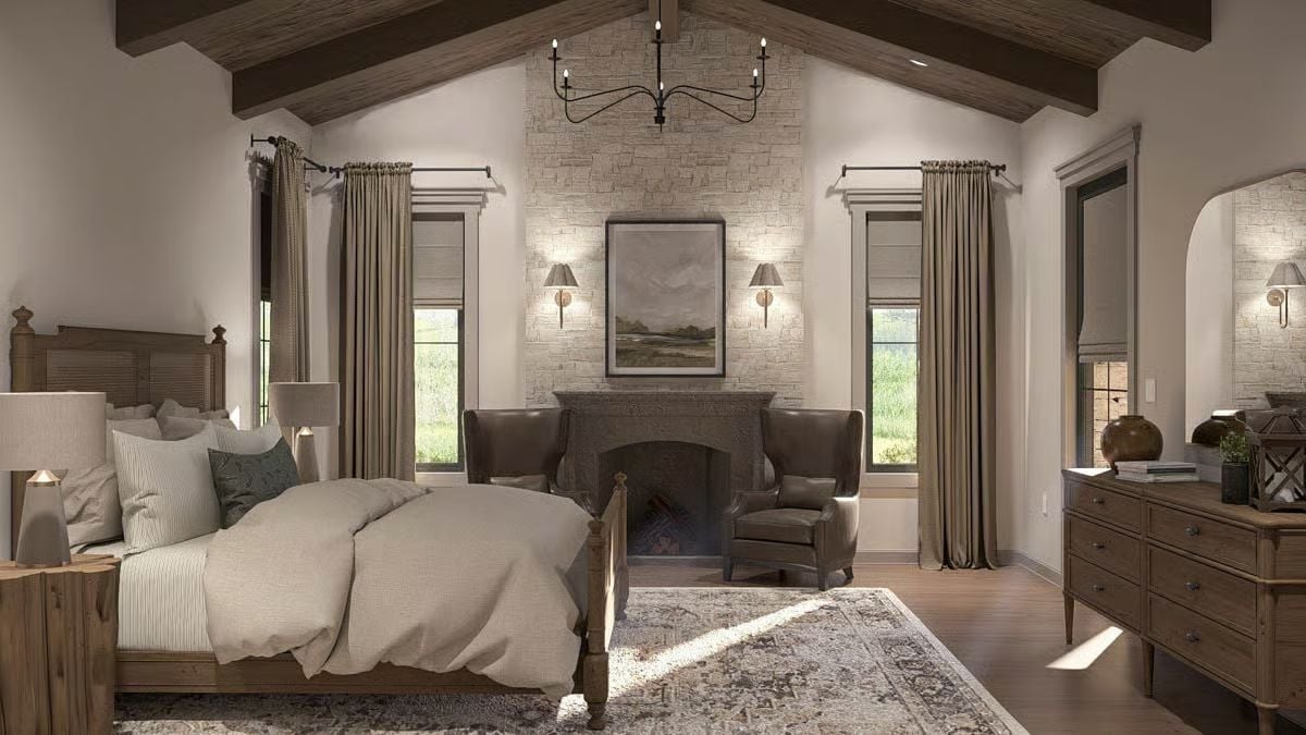 Vaulted Beams and Firelight Make This Bedroom Feel Like a Retreat You Actually Earned