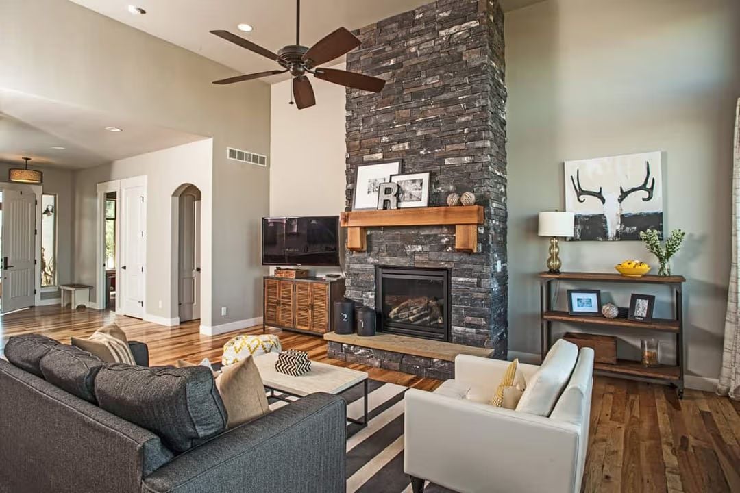 Floor-to-Ceiling Stone and a Wood Mantel That Actually Earns Its Keep