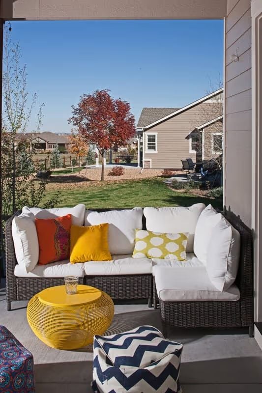 Wicker Sectional With Pops of Yellow That Make Fall Afternoons Feel Intentional