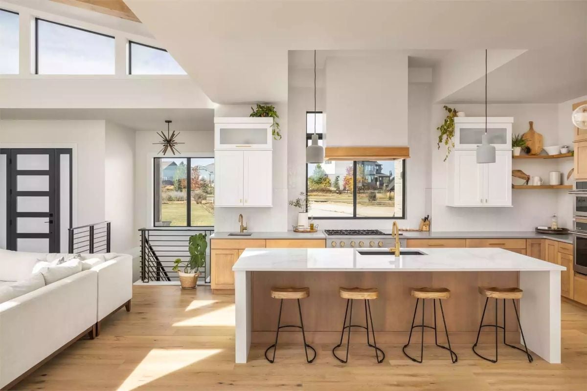 Gold Fixtures, Warm Wood, and a Kitchen Island Built for Four