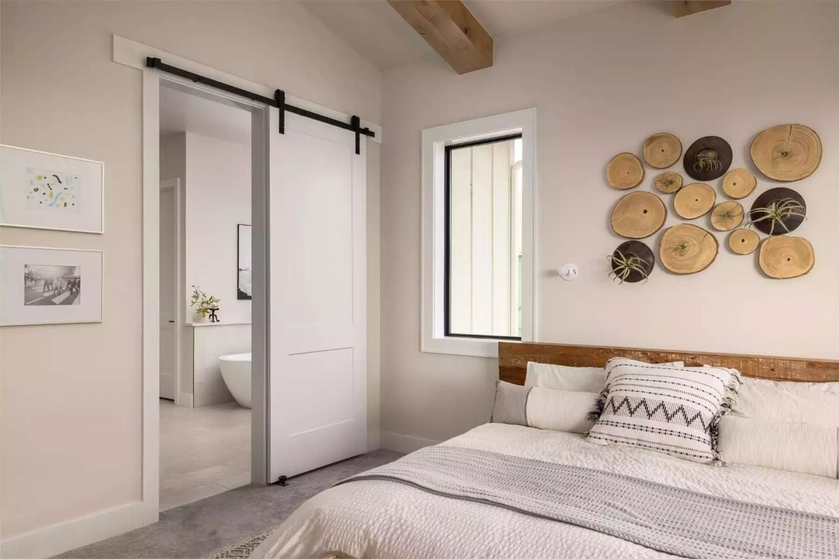 Wood Slices on the Wall and a Barn Door That Actually Earns Its Place