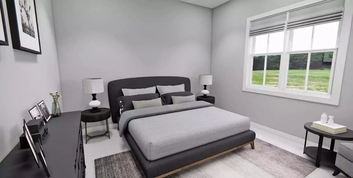 Charcoal Upholstered Bed Frame Anchors a Room That Knows When to Stop
