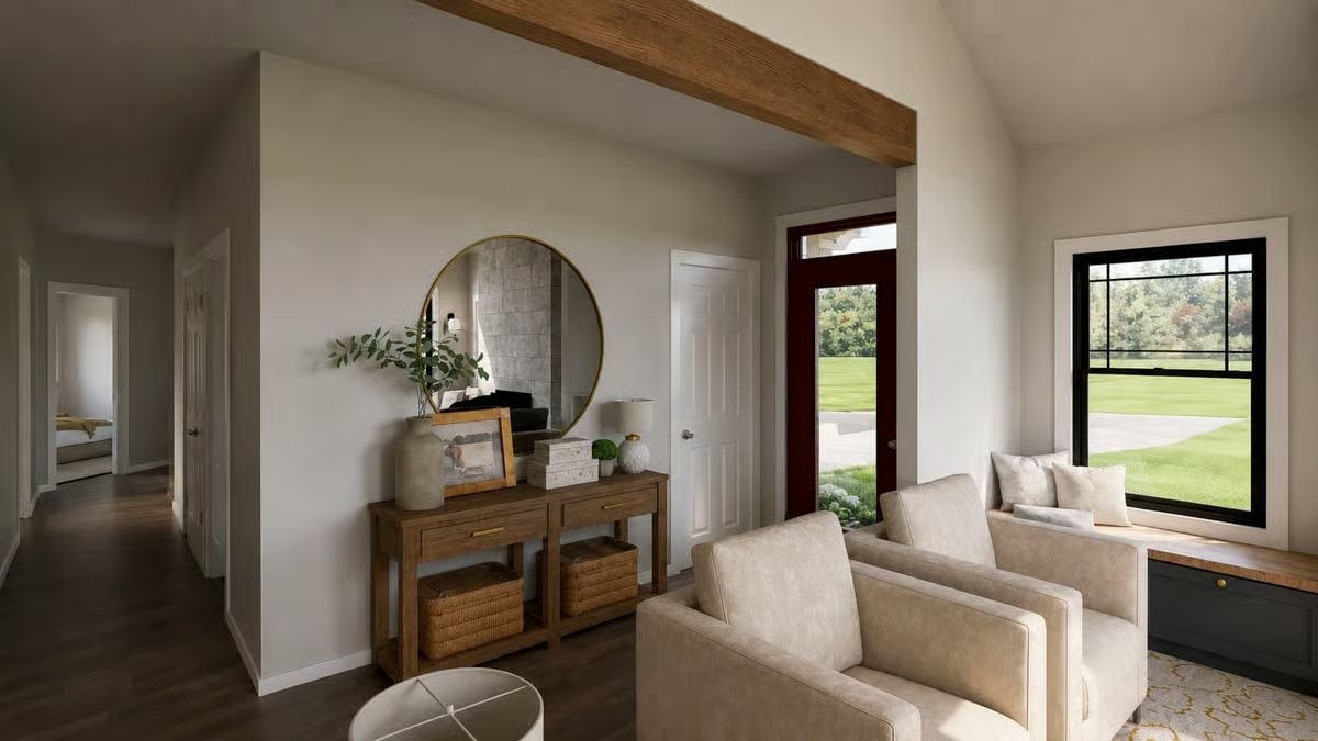 Warm Wood Beam, Cream Chairs, and a Round Mirror That Earns Its Spot on the Wall