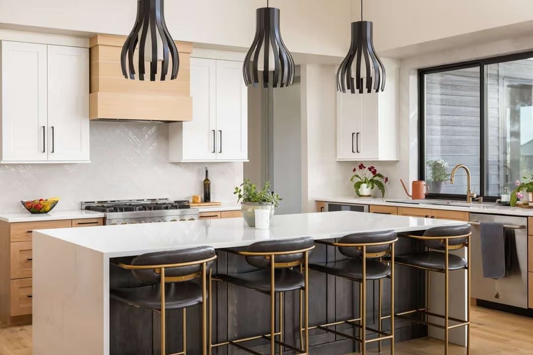 Cage Pendants and Gold-Legged Stools for Empty Nesters Who Haven't Slowed Down