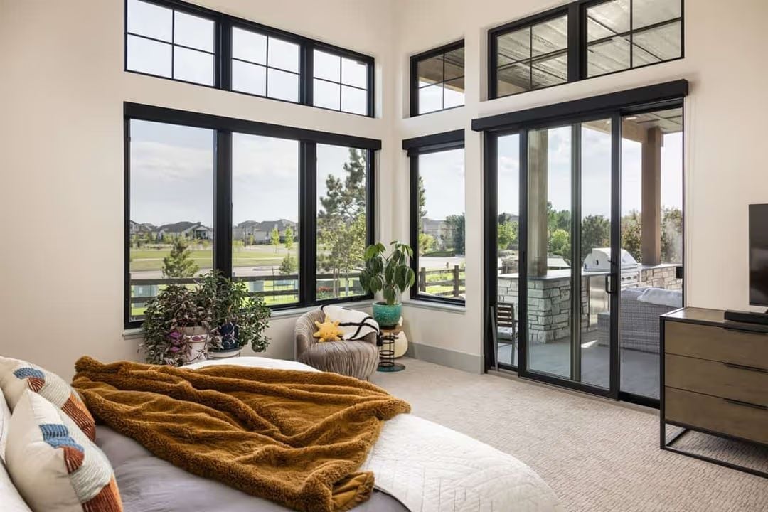 Corner Windows That Turn a Bedroom Into a Treetop Perch