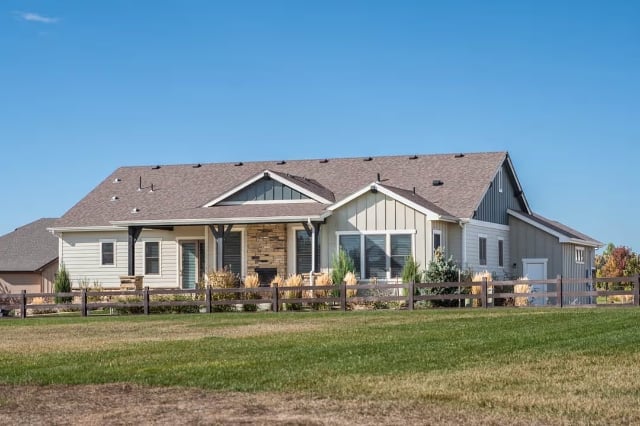 Craftsman Ranch Sitting Pretty on Open Acreage with Board-and-Batten and Stone Accents