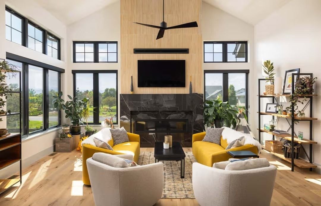 Yellow Chairs by a Black Marble Fireplace That Means Business