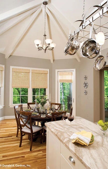 Pot Rack, Vaulted Ceiling, and a Round Table Built for Long Dinners