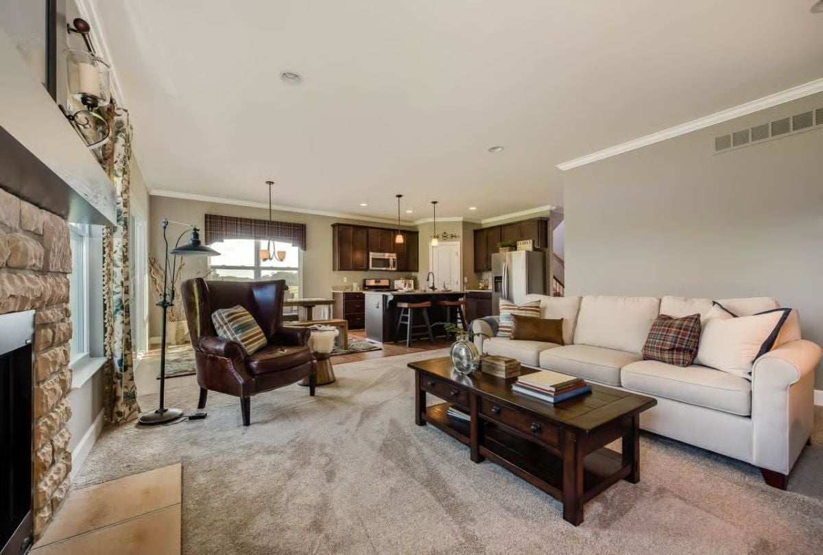 Cream Sofa, Stone Fireplace, Open Kitchen — Three Zones That Actually Work Together