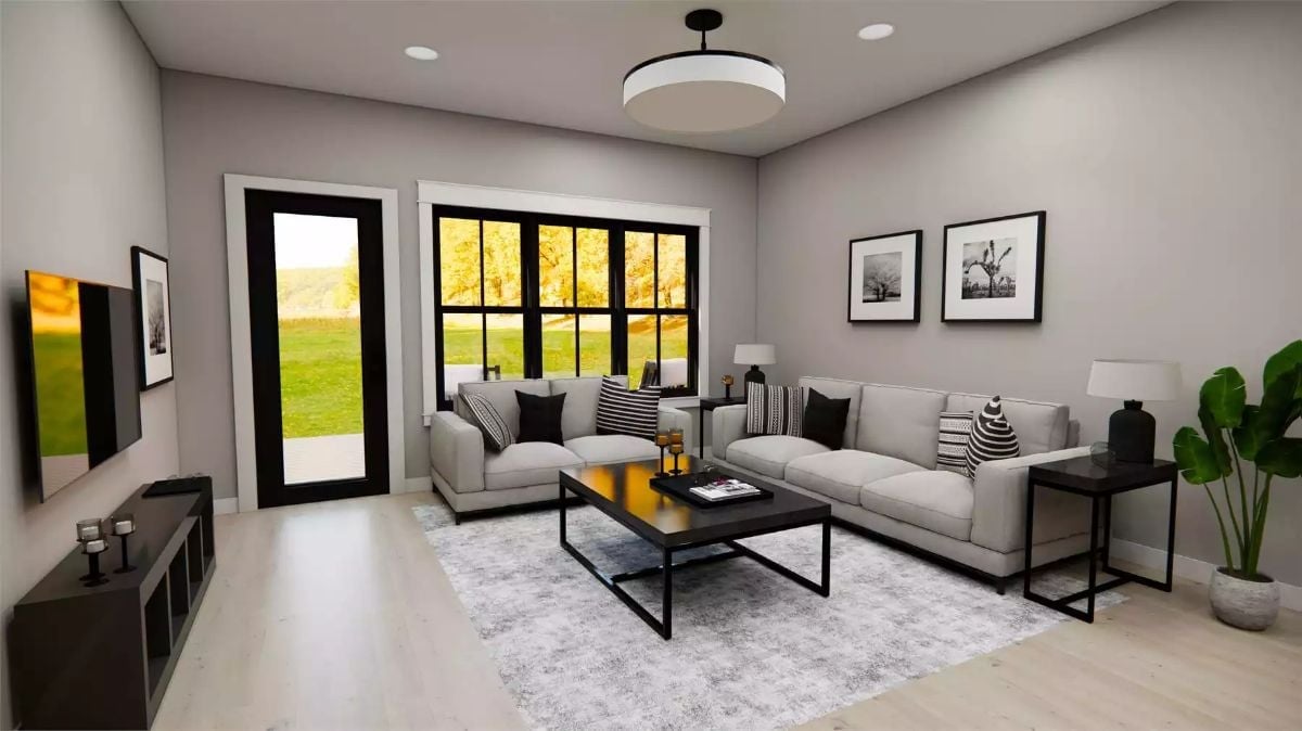 Black-Framed Windows Do the Heavy Lifting in This Gray Living Room