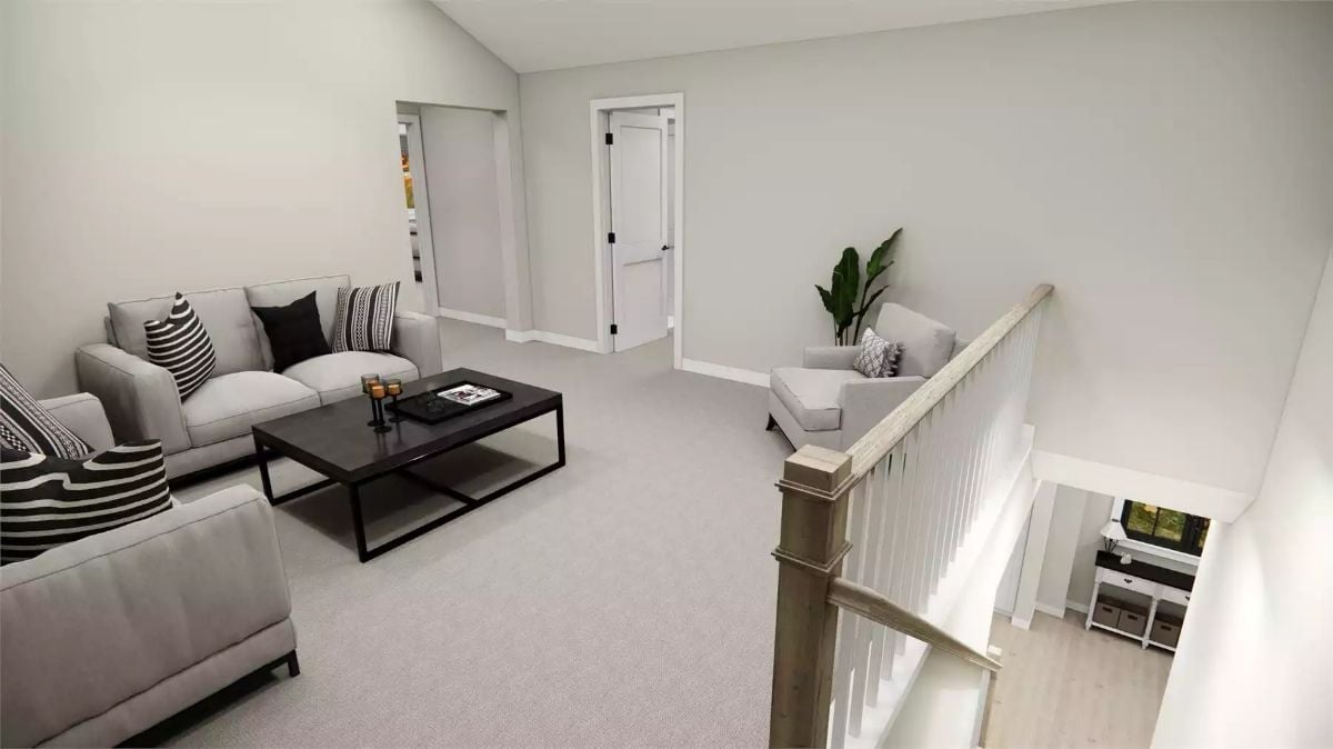 Vaulted Loft With Carpet and a Staircase That Keeps the Space Honest