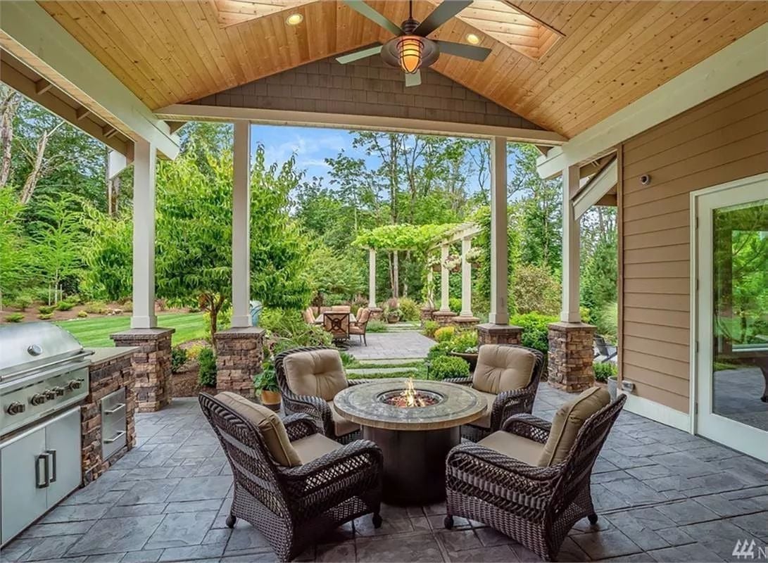 Covered Patio With a Gas Fire Pit Table Earns Year-Round Use