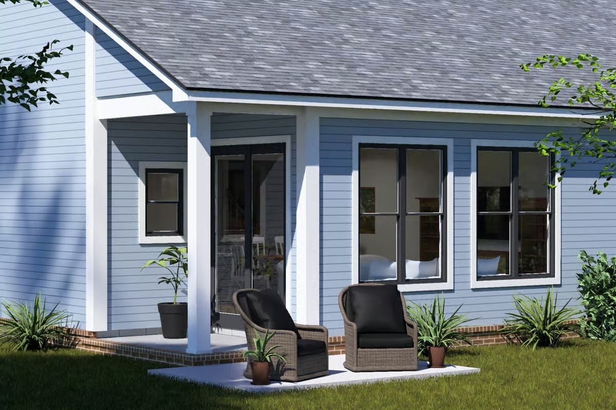 Blue Lap Siding and Wicker Chairs Make the Back Patio Worth Sitting In