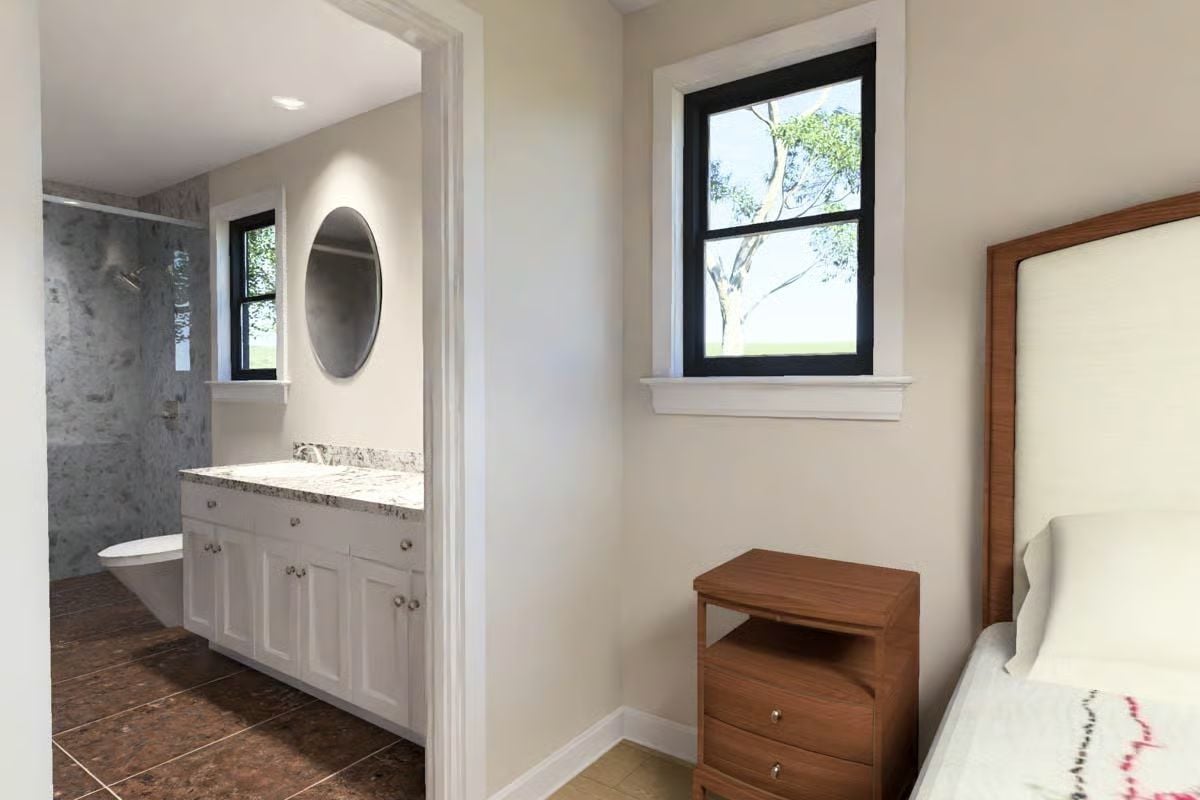 Oval Mirror and Marble Shower Keep the En Suite From Taking Itself Too Seriously