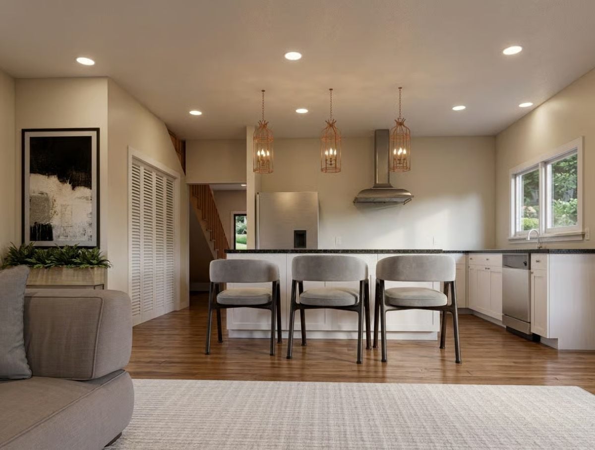 Copper Cage Pendants Over a Black Granite Island That Means Business