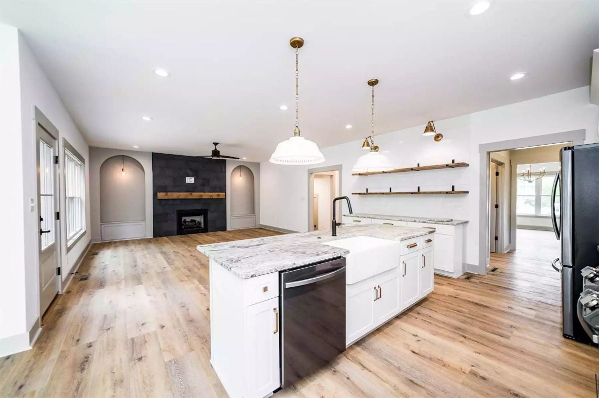 Farmhouse Sink, Floating Shelves, and a Fireplace Wall That Earns Its Square Footage