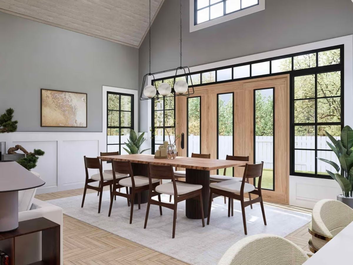 Walnut Chairs and a Fluted Pedestal Base Doing the Heavy Lifting in This Dining Room
