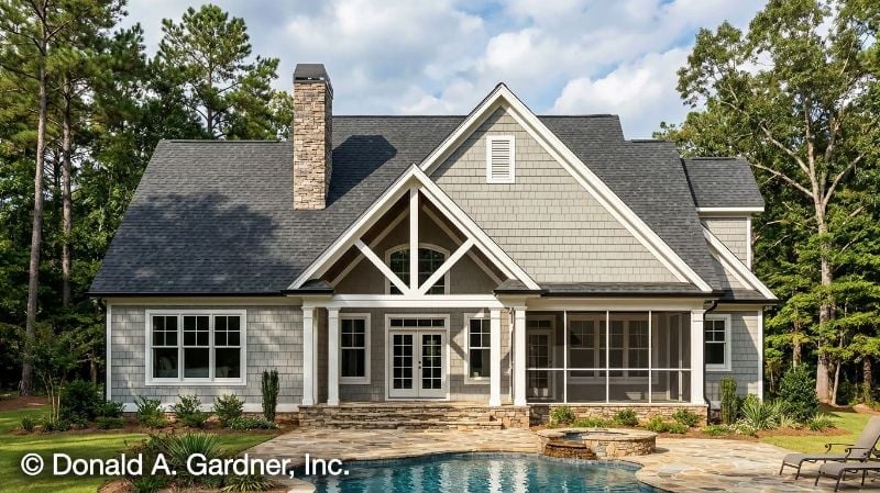 Gray Shakes, Exposed Timber, and a Pool That Earns the View