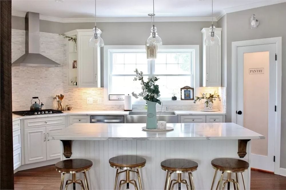 Marble Island, Gold Stools, and a Pantry Door That Earns Its Label