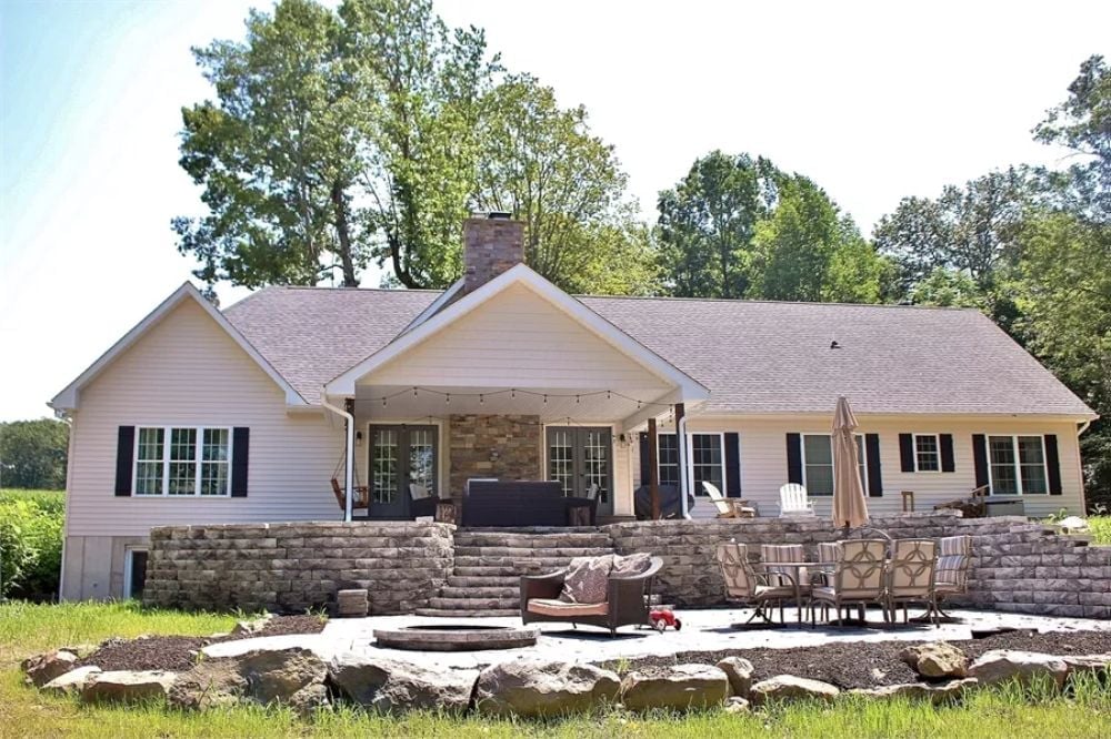 Raised Stone Patio With a Fire Pit That Actually Has Room to Breathe