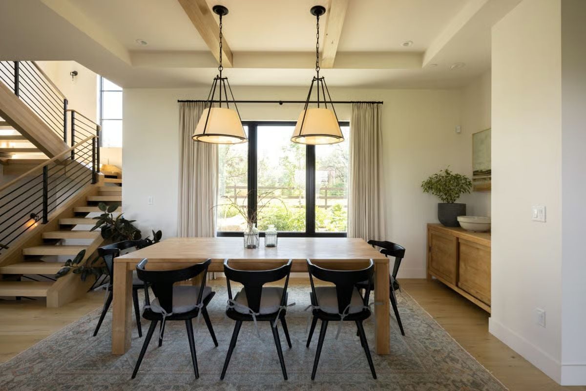 Black Chairs Against Blonde Oak Create Contrast Worth Stealing