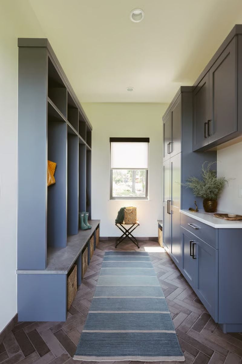 Blue-Gray Lockers and Herringbone Brick Give This Mudroom Real Purpose