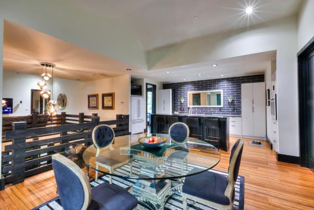 Glass Table, Subway Tile, and a Railing That Clearly Has Opinions