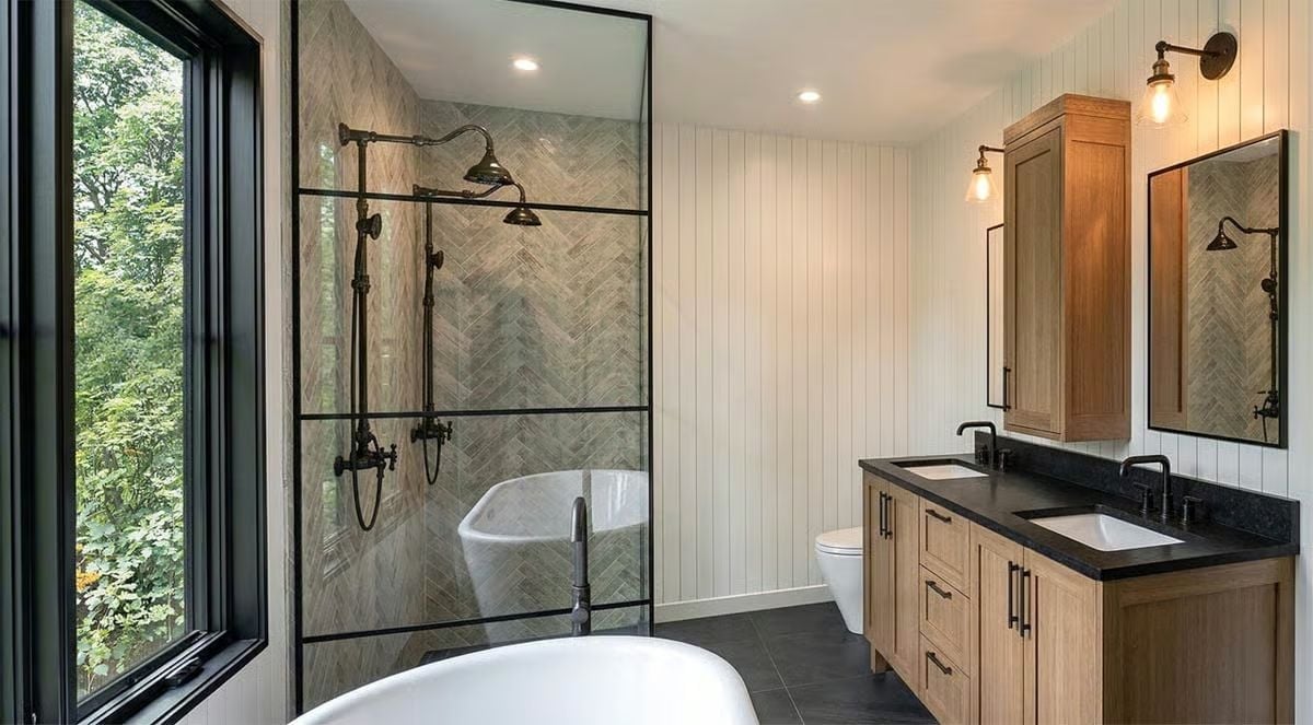 Black Steel, Herringbone Tile, and a Soaker Tub That Earns Its Square Footage