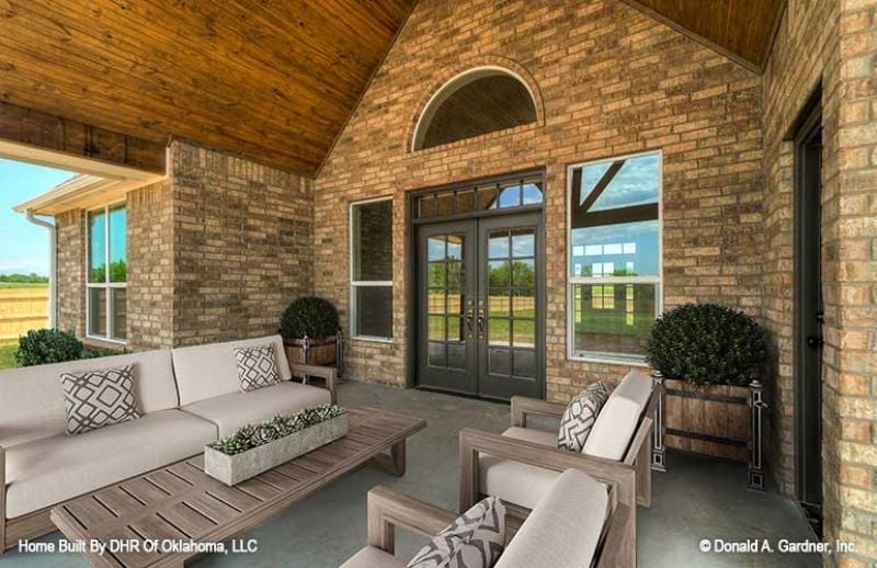 Covered Back Porch Where Brick Walls and Beadboard Ceilings Pull Their Weight