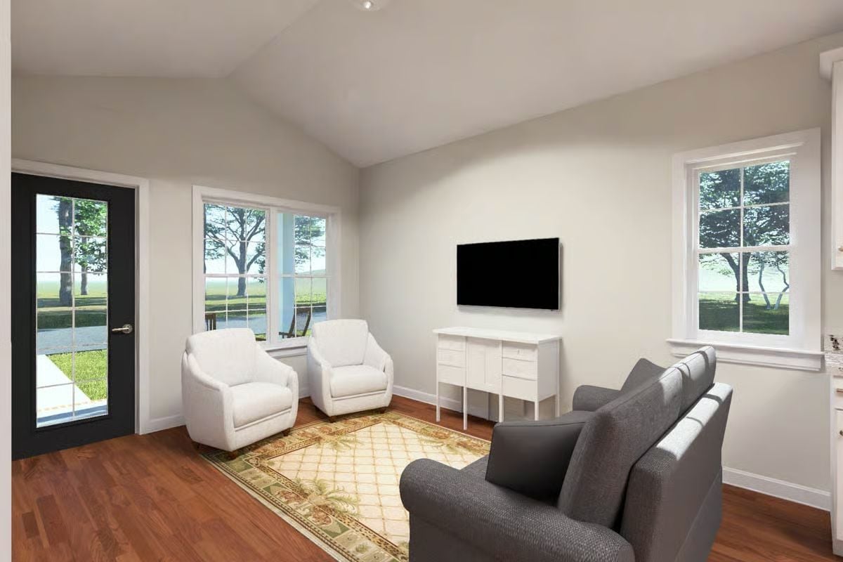 Vaulted Ceilings and Warm Wood Floors Make This Sitting Room Feel Bigger Than It Is