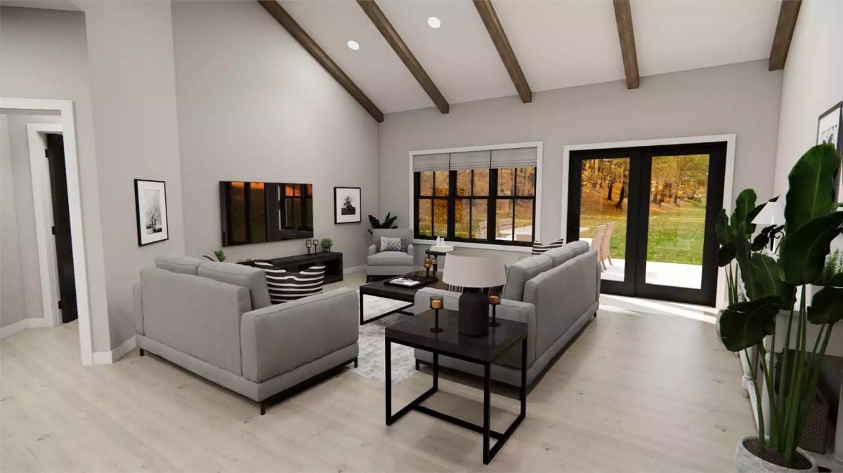 Exposed Ceiling Beams and Vaulted Ceilings Make This Living Room Feel Earned