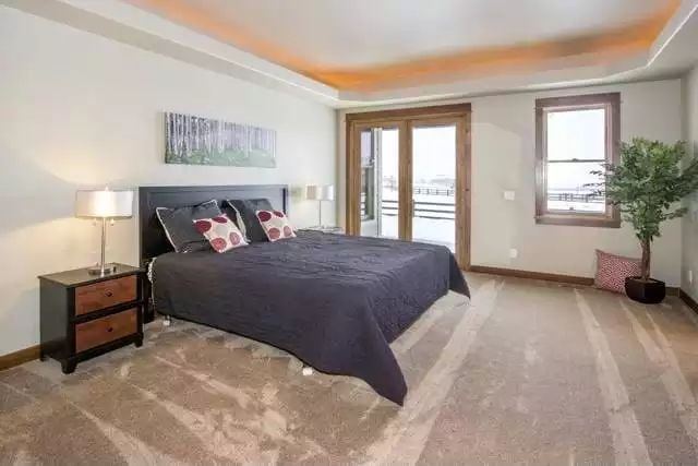 Tray Ceiling Glow and Dark Bedding in a Master Suite That Earns Its Square Footage