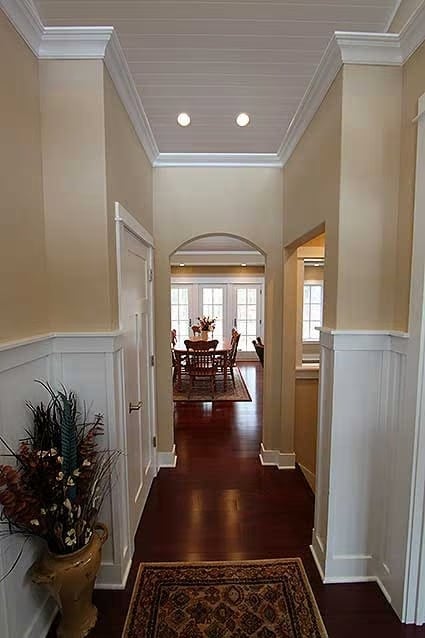 Crown Molding and Wainscoting Carry the Whole Hallway