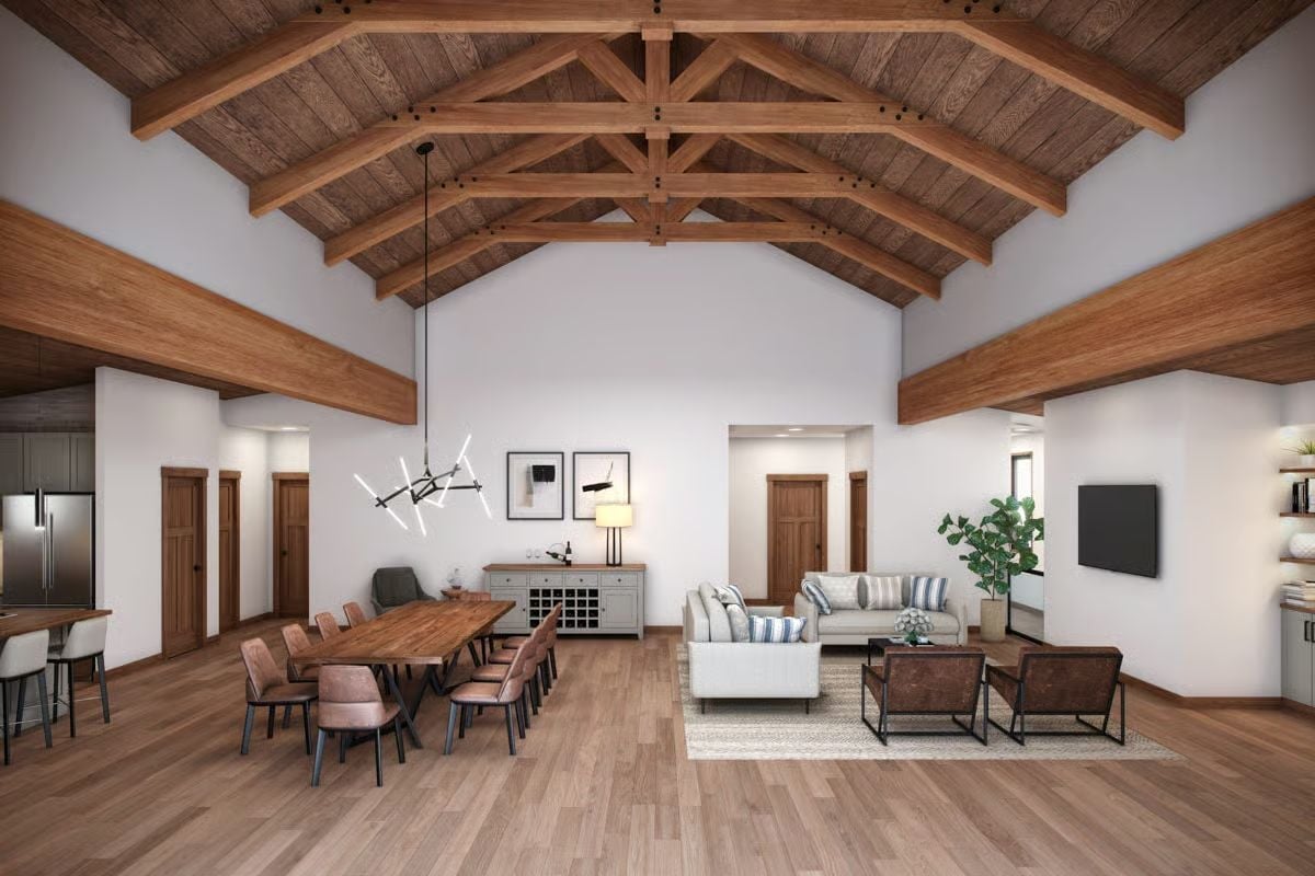 Exposed King Post Trusses Turn the Ceiling Into the Statement