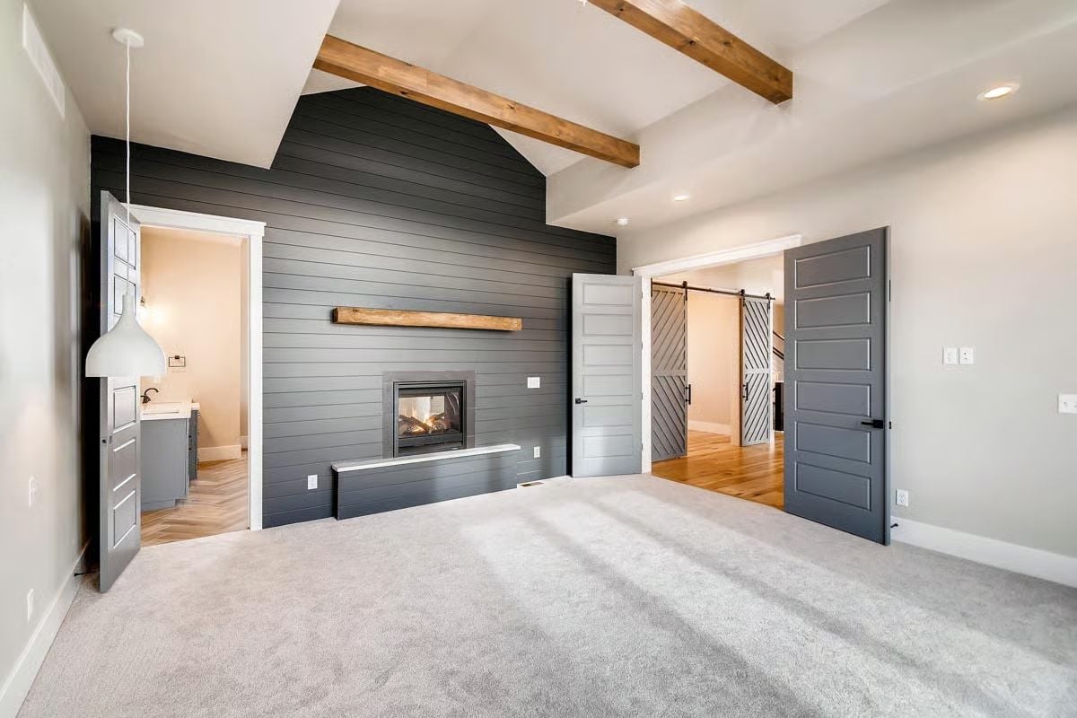 Dark Shiplap Accent Wall with a Fireplace Built Into the Bump-Out