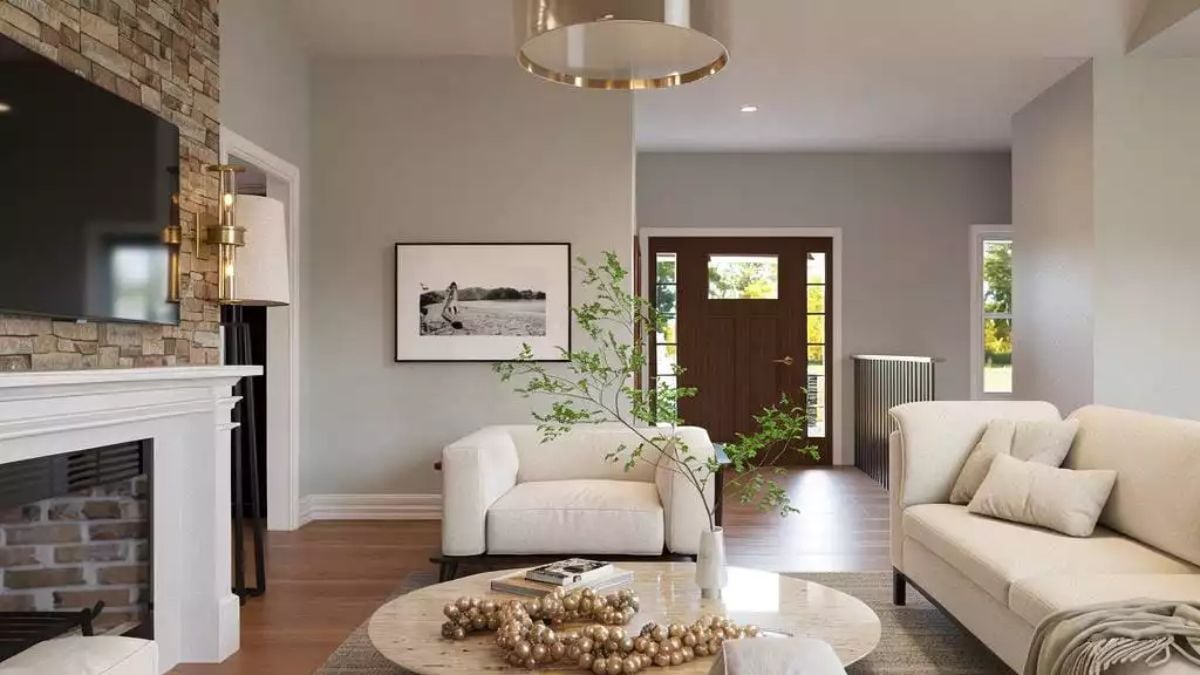 Stone Fireplace Wall and Cream Upholstery Pull This Living Room Together
