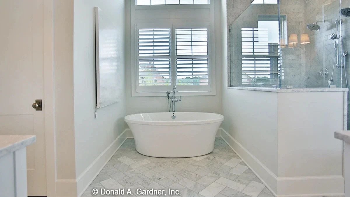 Freestanding Soaker, Marble Tile, and a Shower Stall That Doesn't Apologize for Its Size