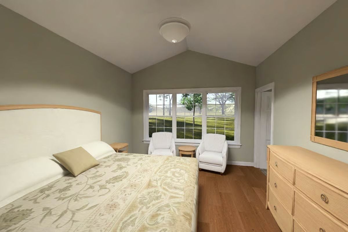 Vaulted Ceiling, Hardwood Floor, and Two Chairs That Invite You to Stay Awhile