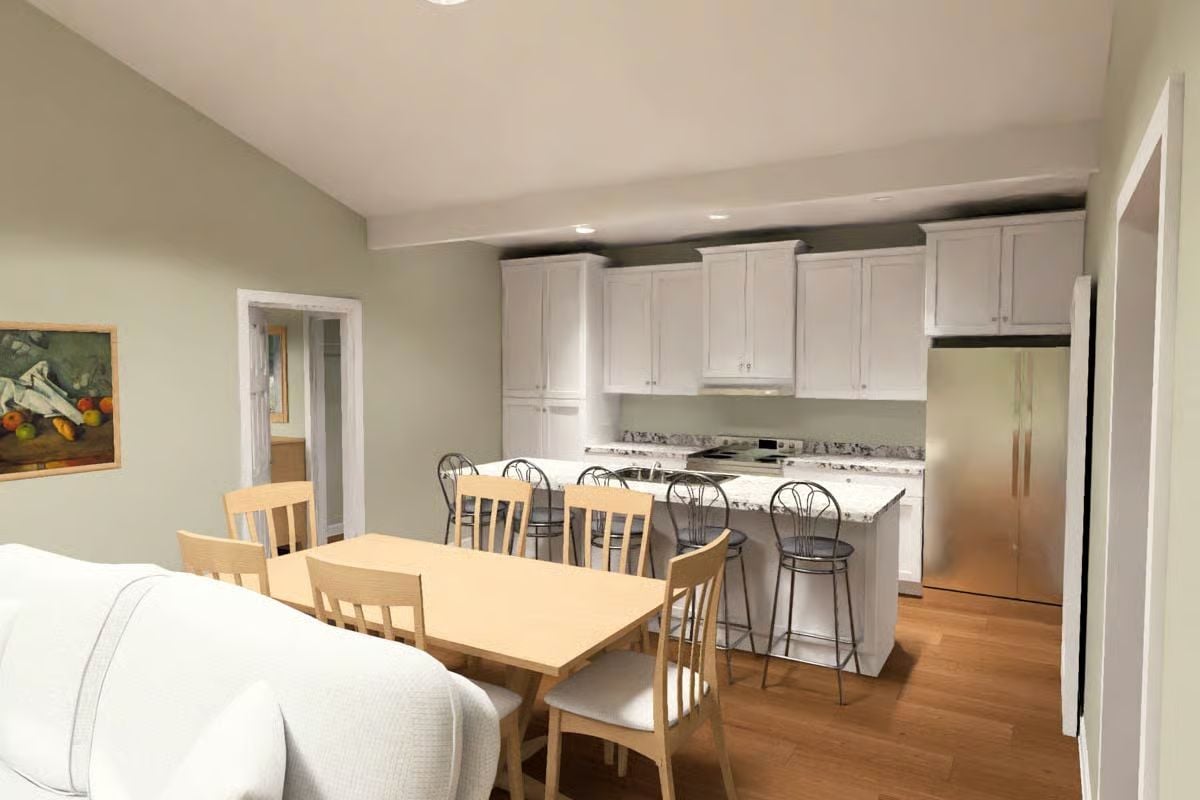 White Cabinets, Granite Counters, and a Kitchen Island That Pulls Double Duty