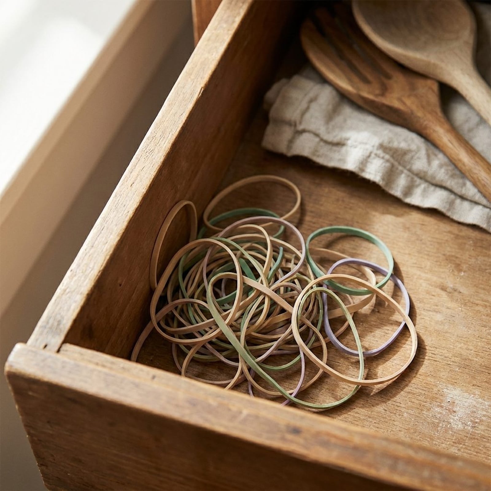 Rubber bands and other small objects saved in a household junk drawer