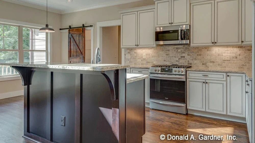 Dark Island Base, Barn Door, Stone Backsplash — Three Contrasts That Actually Work