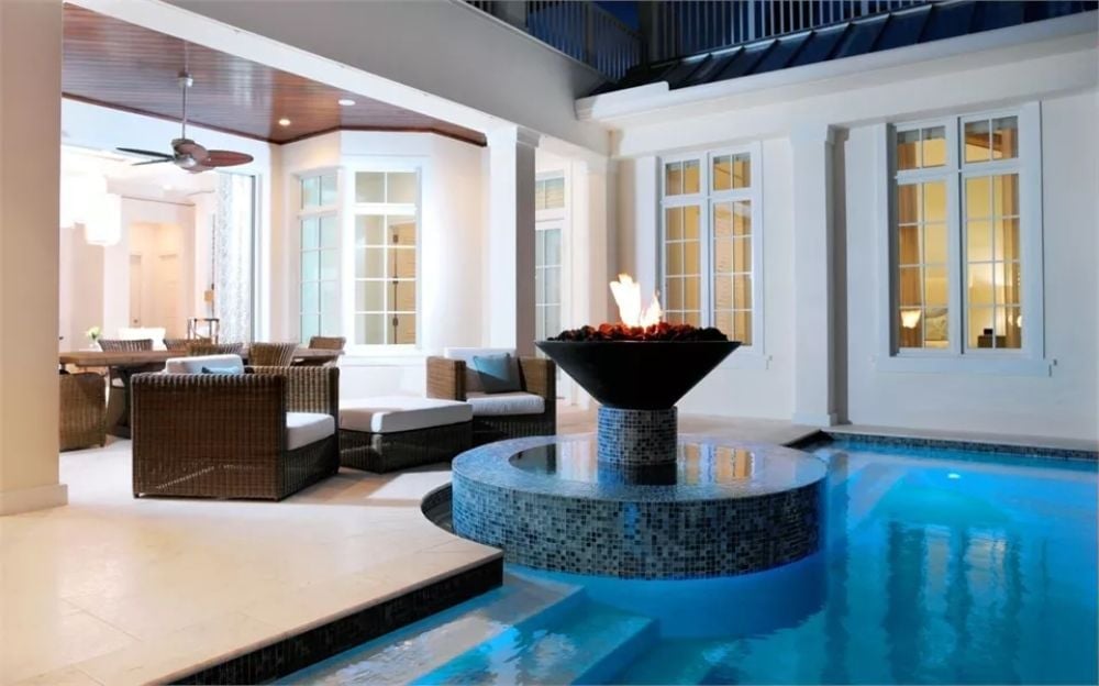 Fire Bowl Over the Spa, and the Pool Glows Blue Underneath It