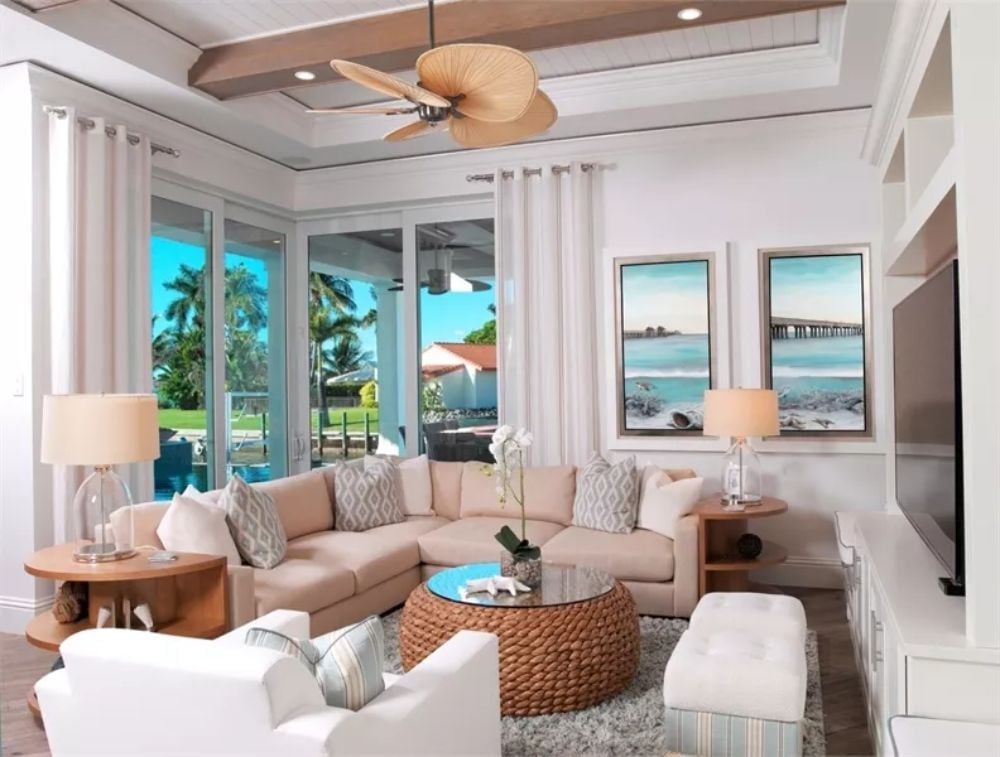 Woven Rattan, Pale Linen, and Ocean Art Doing Exactly What They Should