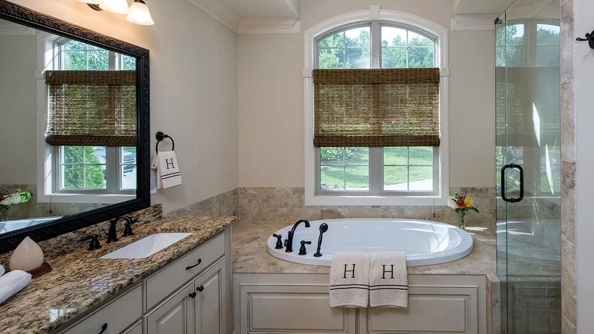 Monogrammed Towels and a Corner Tub That Asks Nothing of You Except Time