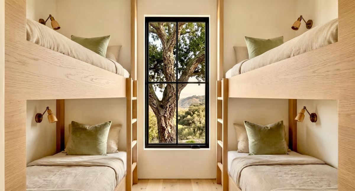 Built-In Bunks, Brass Sconces, and a Window That Earns Its Keep