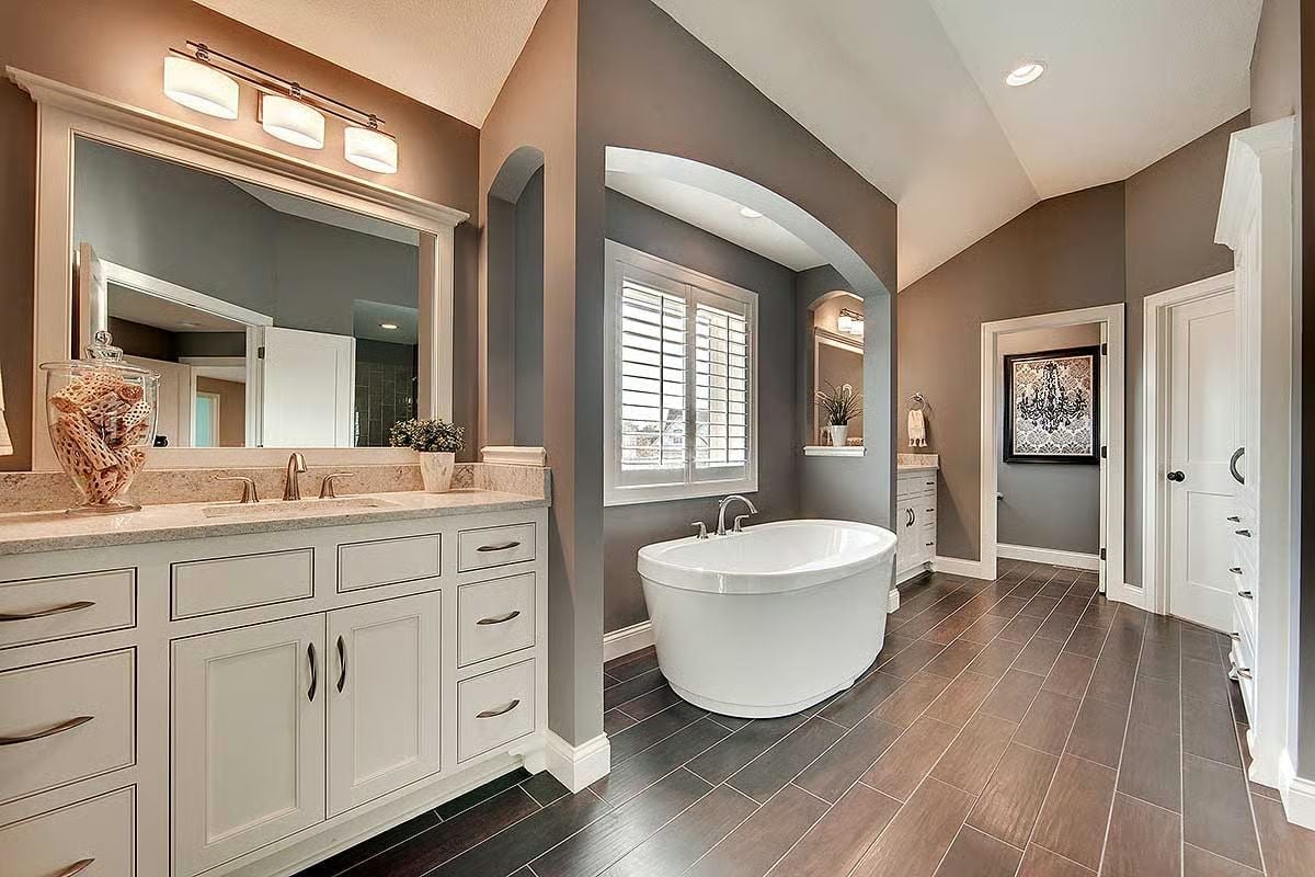 Freestanding Soaker Tub Framed by an Arch That Actually Earns Its Place