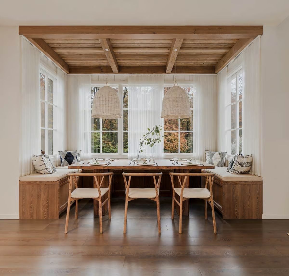 Built-In Bench, Wicker Pendants, and Windows That Do All the Work