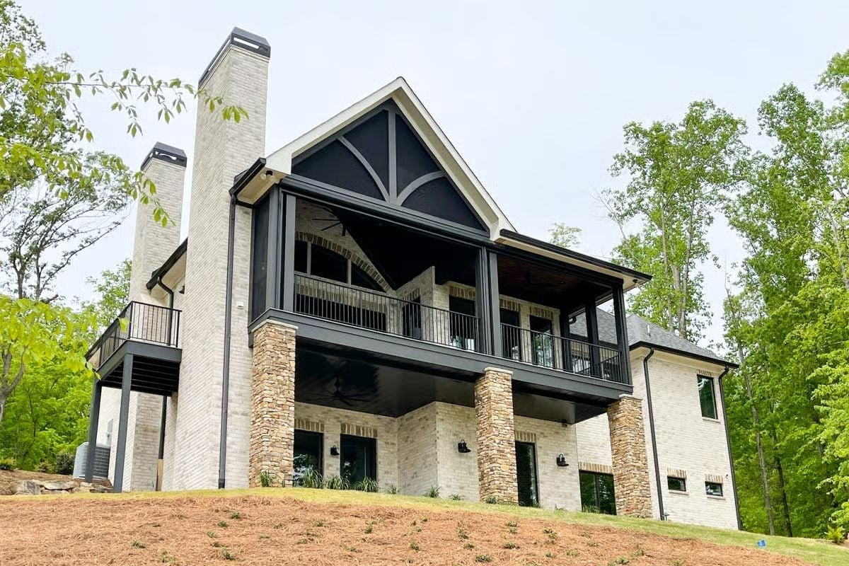 Painted Brick, Stone Columns, and a Gabled Porch That Earns Every Square Foot