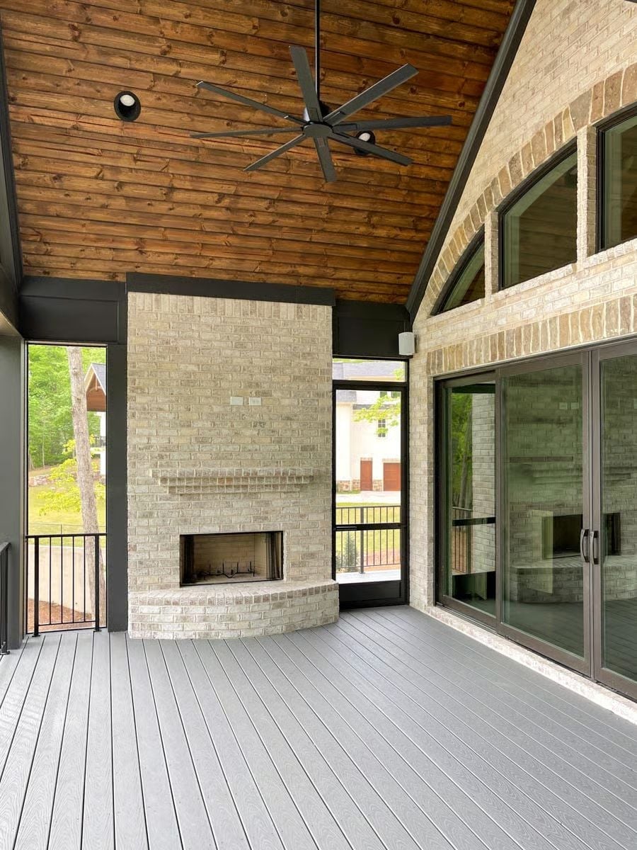Vaulted Cedar Ceiling, Brick Fireplace, and a Deck Built to Handle All of It